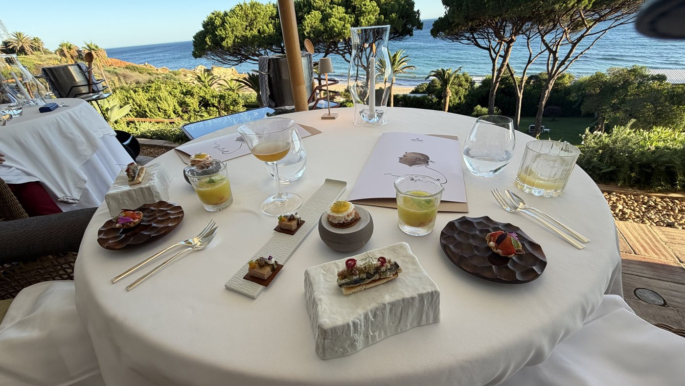 A tasting menu laid out on a terrace table above the sea