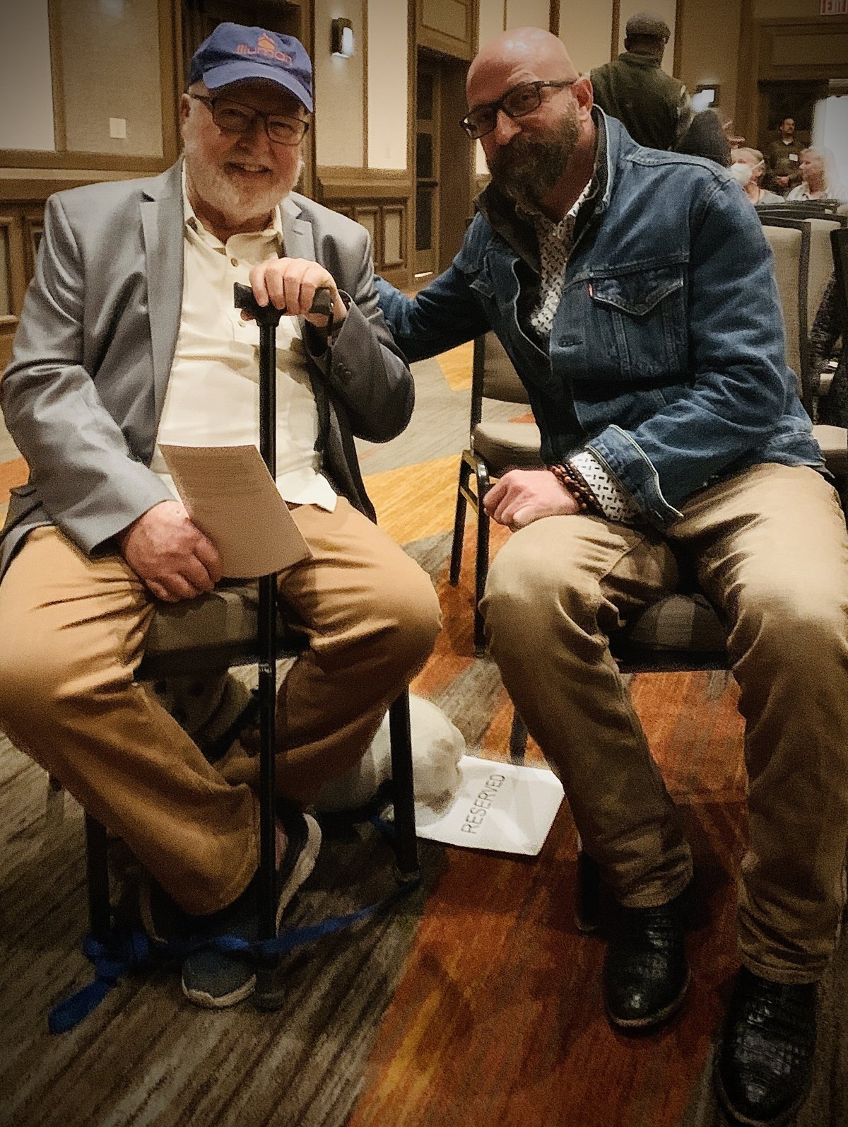 Russ seated beside Father Richard Rohr